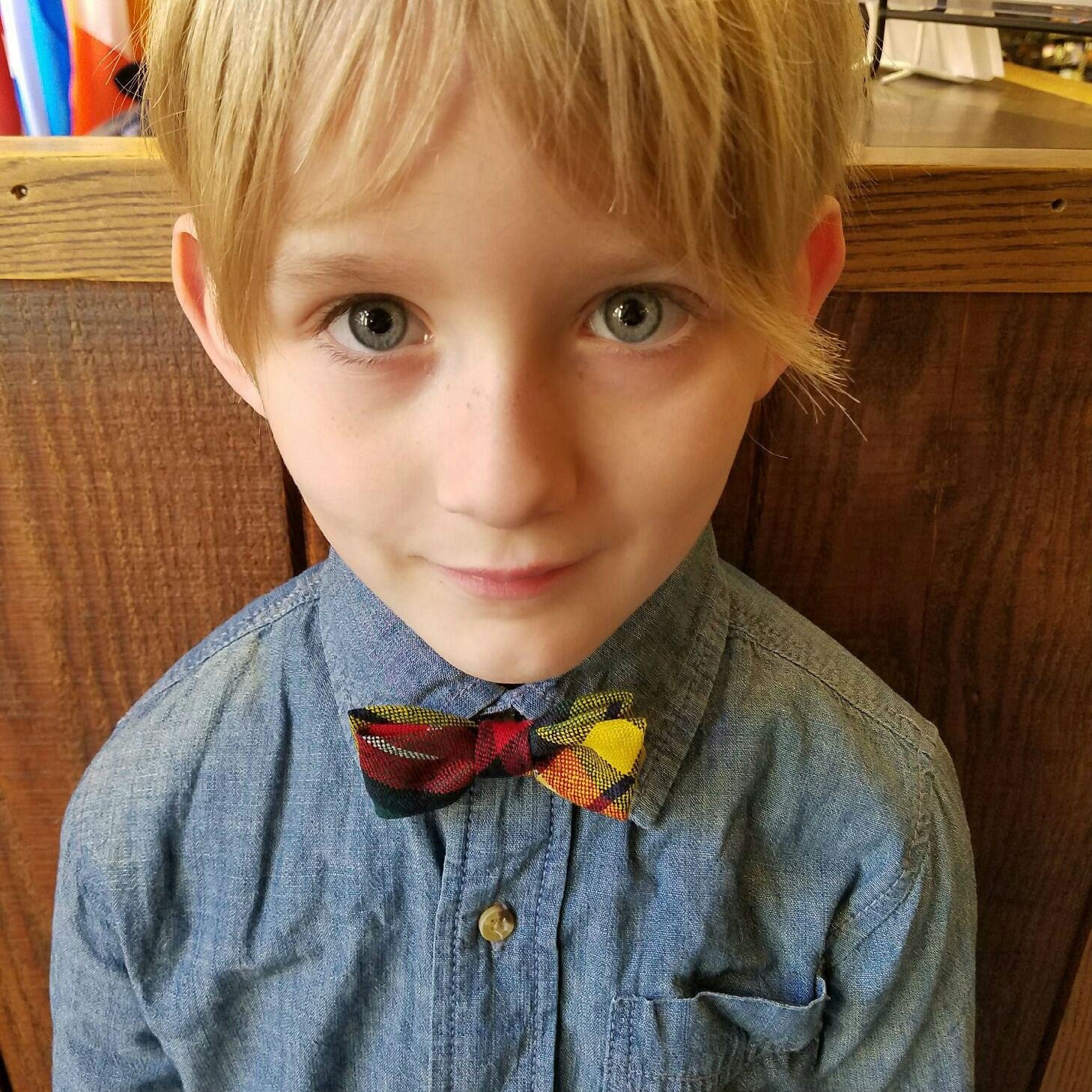 boy with plaid bowtie in the Buchanan modern tartan